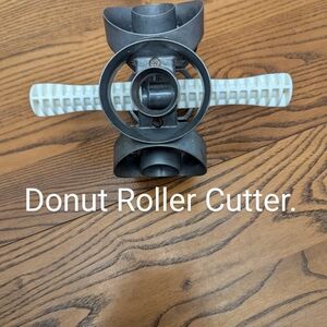 - Donut rotary cutter. Unbranded. Stainless with plastic handles.  2.75 Inches